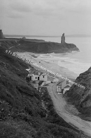 STRAND AND CLIFF SCENE WITH HOUSES